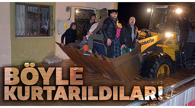 Su baskınında mahsur kalan aile kepçeyle kurtarıldı