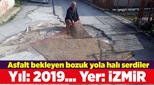 Asfalt bekleyen bozuk yola halı serdiler