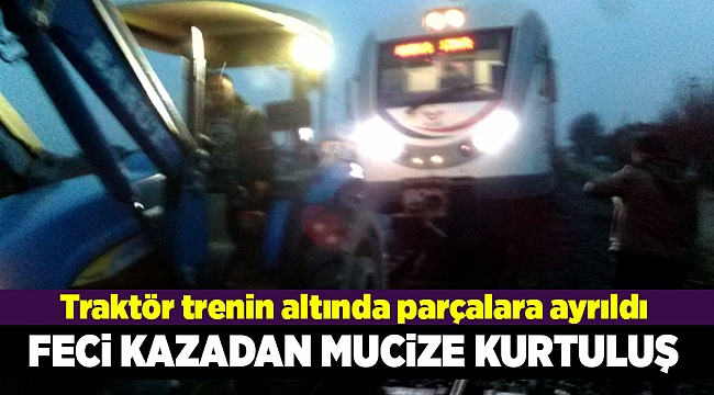 Trenin altında parçalara ayrılan traktörün sürücüsü yara almadan kurtuldu