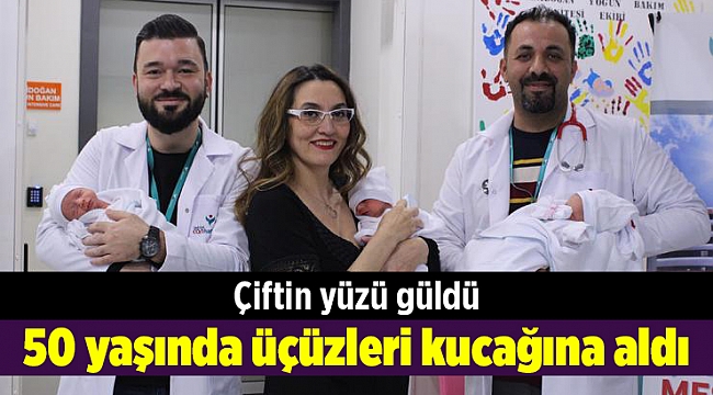 50 yaşında üçüzleri kucağına aldı