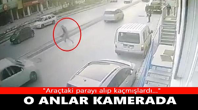 Kapkaççıların araçtaki çantayı alıp kaçtığı anlar kameraya yansıdı