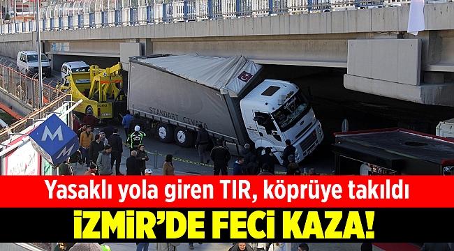 İzmir’de yasaklı yola giren tır, köprüye takıldı