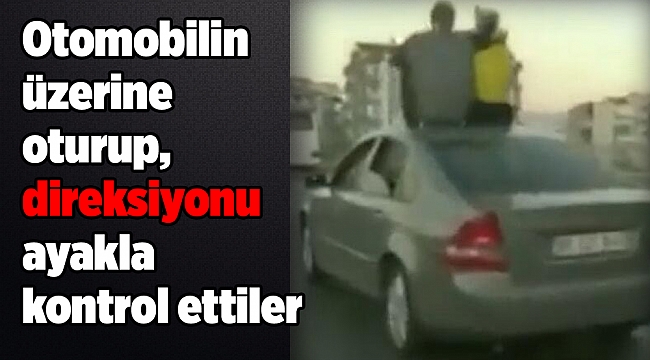 Otomobilin üzerine oturup, direksiyonu ayakla kontrol ettiler