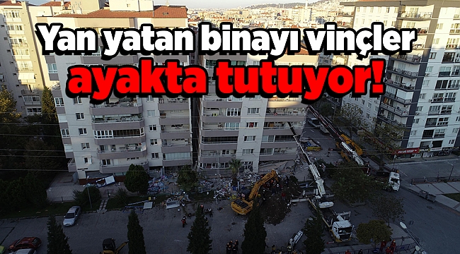 Yan yatan binayı vinçler ayakta tutuyor!