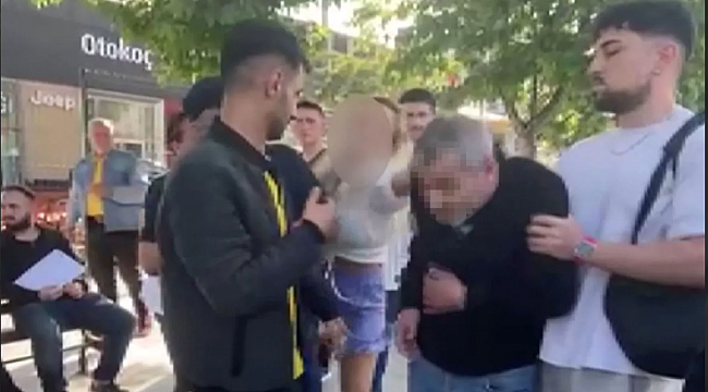 Gizlice fotoğrafını çeken adamı yakalayıp önce yüzüne tükürdü sonra dövdü