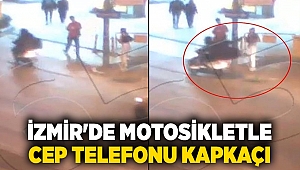 İzmir'de motosikletle cep telefonu kapkaçı kamerada