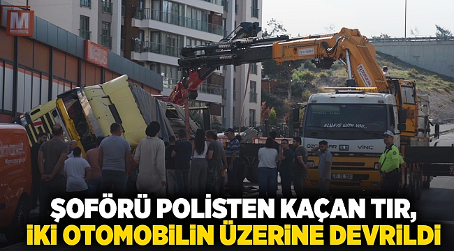 İzmir&#039;de şoförü polisten kaçan TIR, iki otomobilin üzerine devrildi; 2 yaralı
