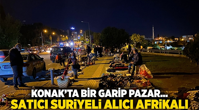 Konak’ta bir garip pazar...  Satıcı Suriyeli alıcı afrikalı